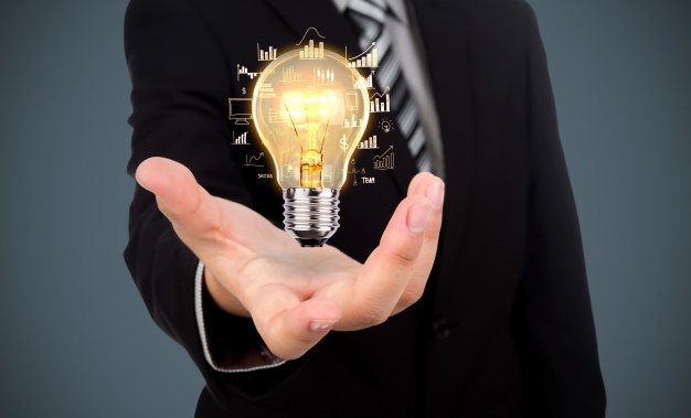 businessman-with-light-bulb-his-hand_1232-891